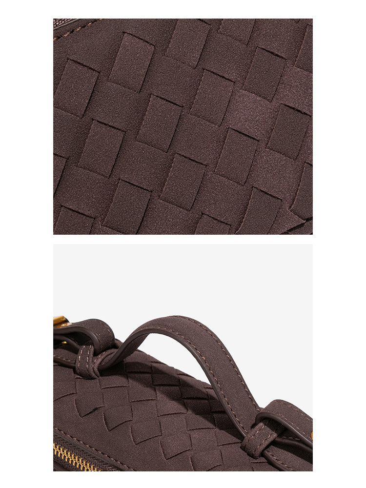 Close-up of woven vegan leather texture and stitched top handle on chocolate brown crossbody bag