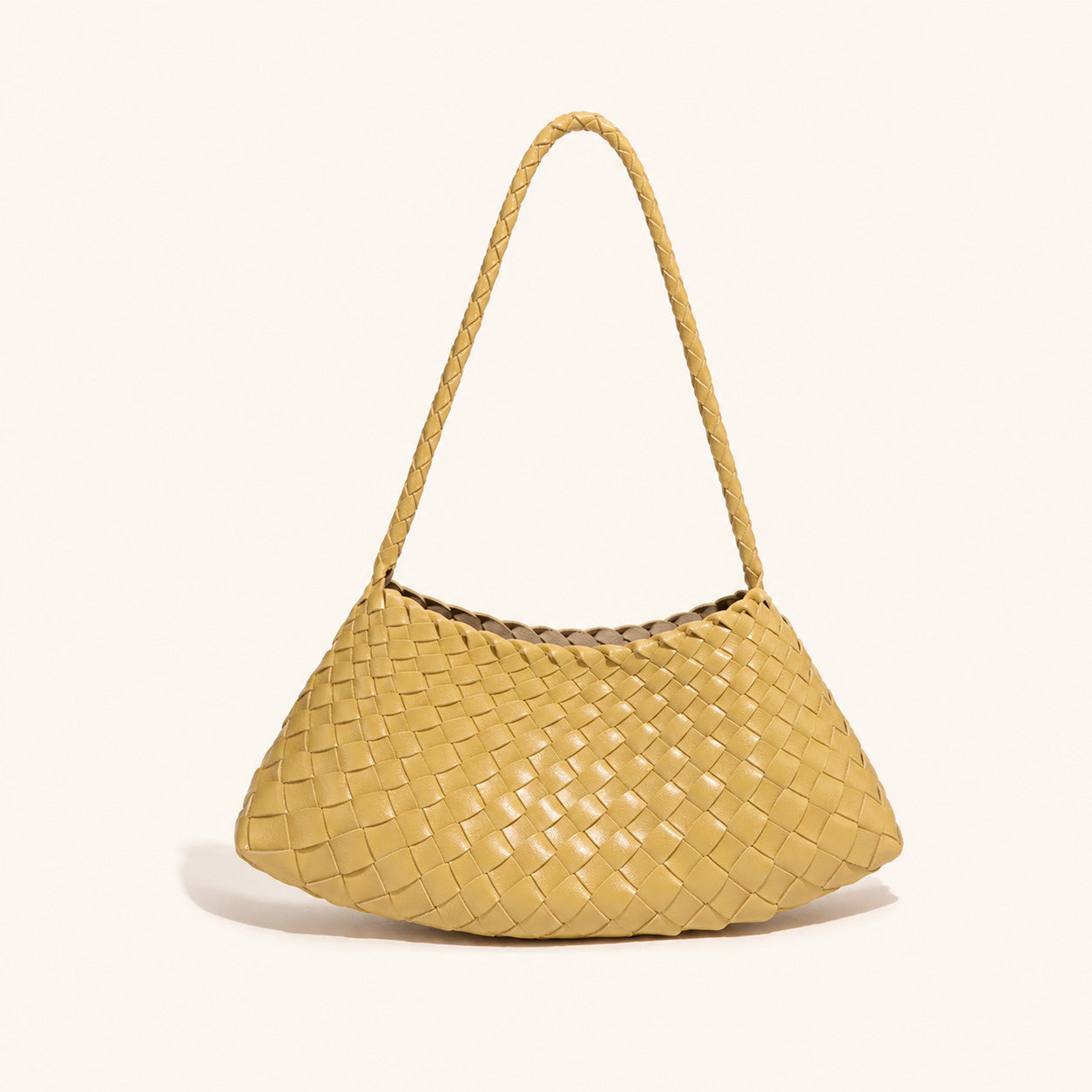 Warm yellow woven vegan leather shoulder bag with curved everyday shape